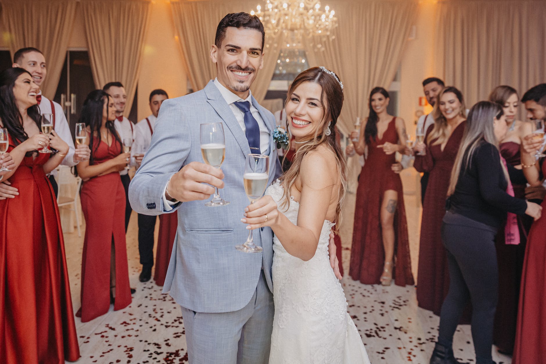 newlyweds holding champagne glasses
