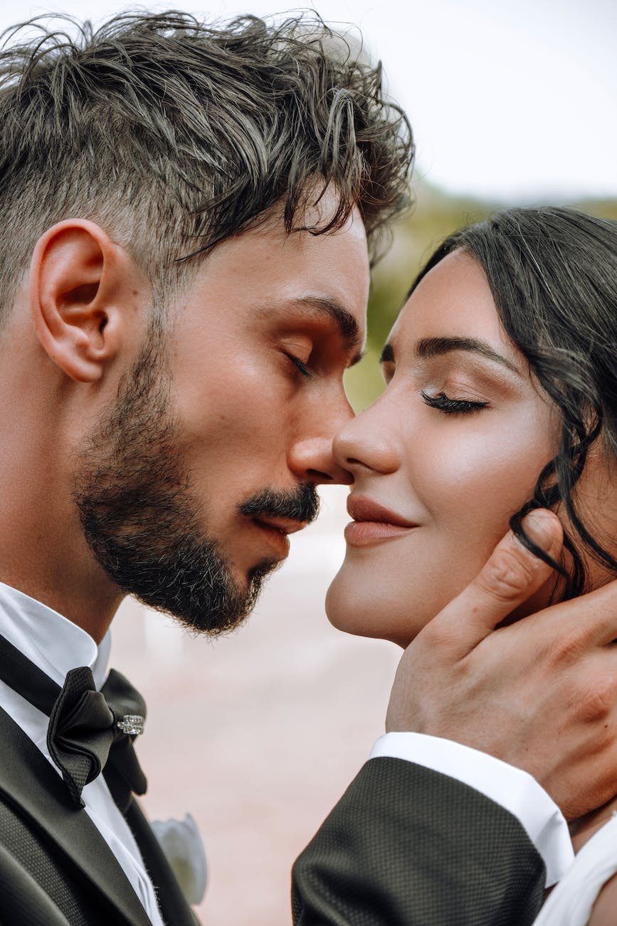 groom intending to kiss bride